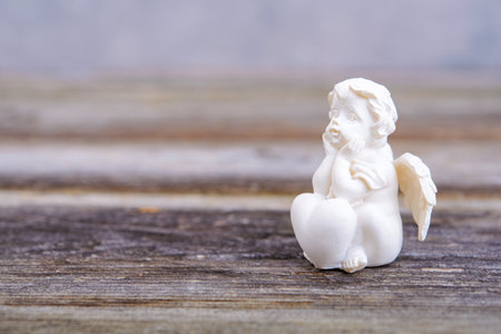Still life with angel on wooden groundの写真素材