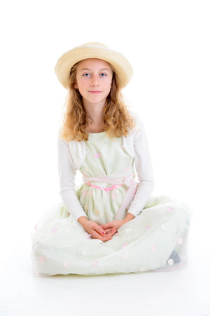 nice girl with blond hair in white dress and straw hatの写真素材