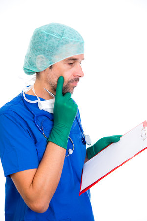 young doctor with clipboard in front of white backgroundの写真素材