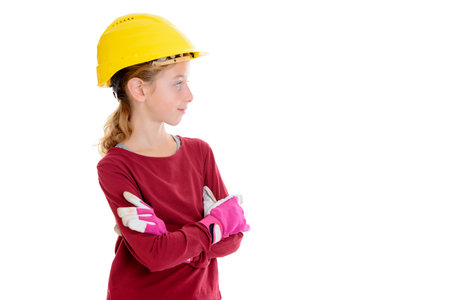 blond girl with helmet and work gloves in front of white backgroundの写真素材