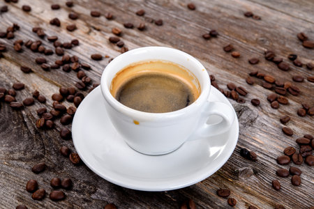 espresso cup with a lot of coffee beansの写真素材