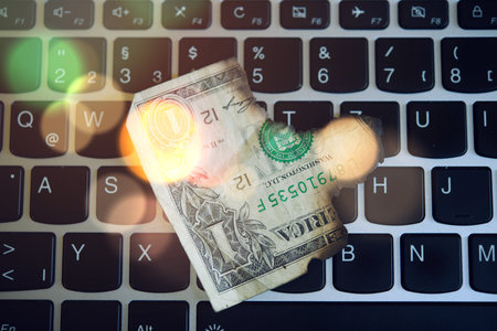 still life- computer keyboard with burned dollar bank notesの写真素材