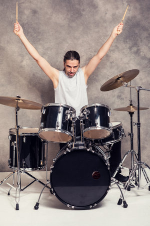 young musician with his black drum setの写真素材