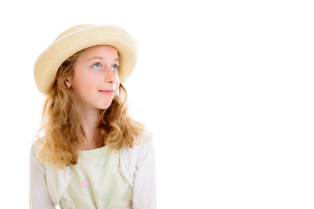 nice girl with blond hair in white dress and straw hatの写真素材