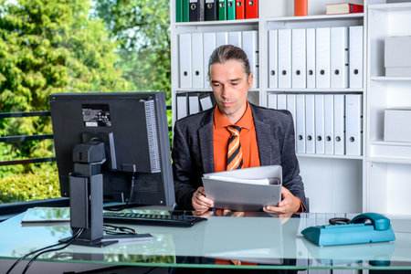 young business man at his desk workingの写真素材