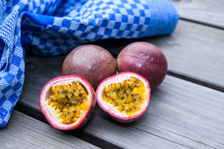 passion fruit with blue towel  on wooden groundの写真素材