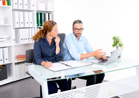 teamwork-  businessman and businesswoman working together in the officeの写真素材