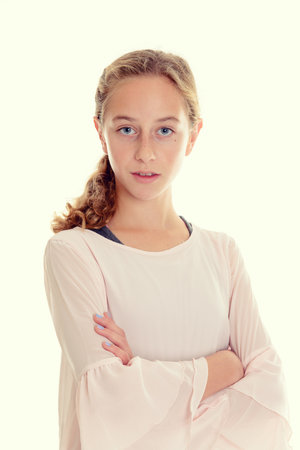 nice girl with blond hair and bright shirt in front of white backgroundの写真素材