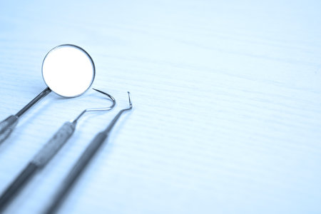 three different dental instruments on bright groundの写真素材