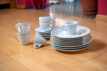 older dishes set on the floor in living roomの写真素材