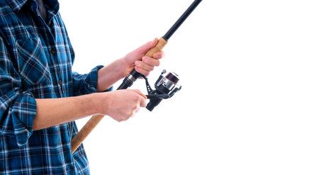 man with fishing rod and blue plaid shirt in front of white backgroundの写真素材