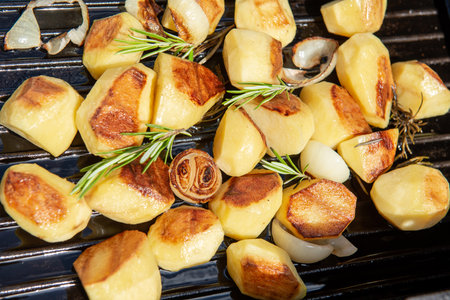 grilled potatos with rosemary on barbecueの写真素材