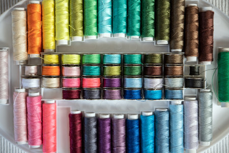 a lot of colorful yarn in organizer boxの写真素材