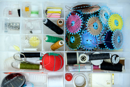 a lot of colorful yarn in organizer boxの写真素材