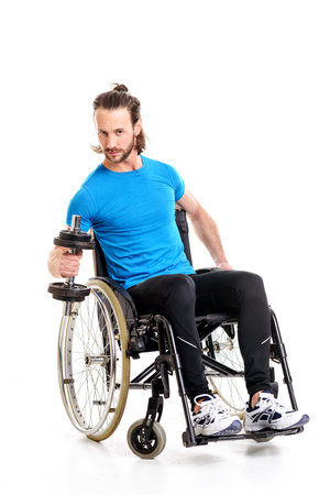young disabled man in wheelchair train with bar-bellの写真素材