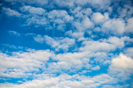 blue sky with much white cloudsの写真素材