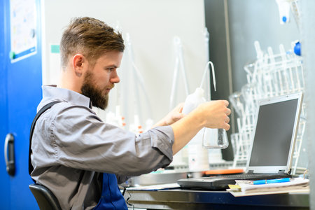 workerwith test tube  in chemical industrial plant