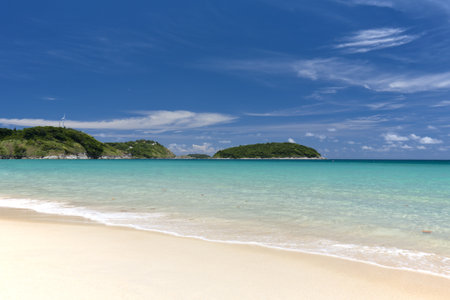 Beach chair and colorful umbrella on the beach in sunny day, Phuket Thailand の写真素材