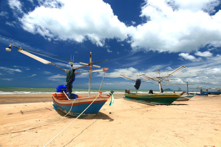 Beach chair and colorful umbrella on the beach in sunny day, Phuket Thailand の写真素材