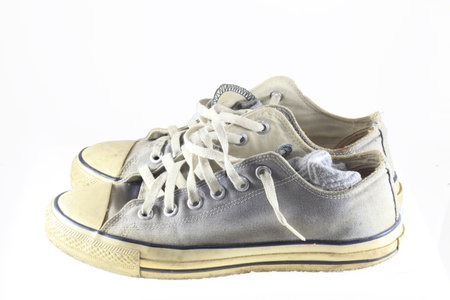 old sneakers on white background  の写真素材
