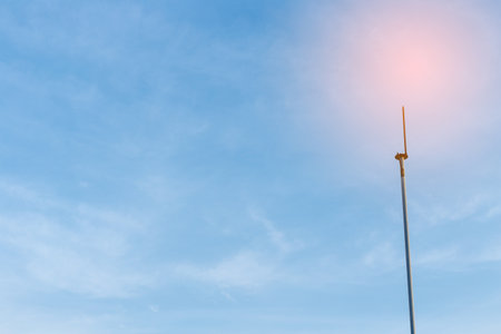 Lightning rod on high building under blue sky.の写真素材