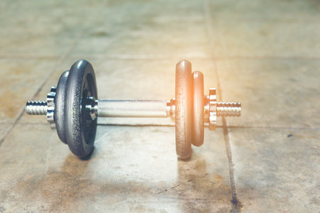 Single Iron Dumbbell on the floor for home workout.の写真素材