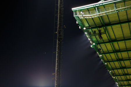 Roof of football stadium between competition under twilight sky at night time.の写真素材