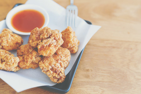 Fried chicken on the table with chilli sauce,serving for appetize.の写真素材