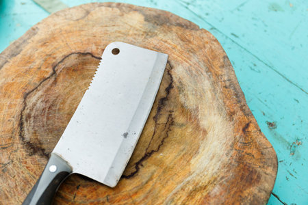 Chopping knife on wooden butcher in a local Thai kitchen.