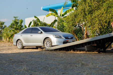 Tow car service on side for loading broken car to the garage.の写真素材