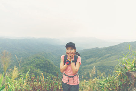 Woman glad and happy when her finish trekking in the Thai forest.の写真素材