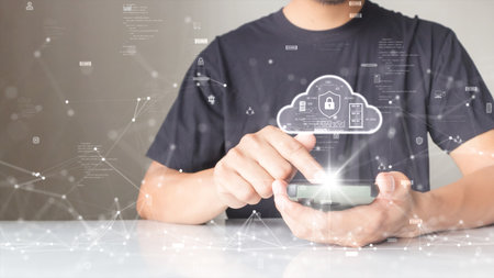 A person is connecting to the Internet through a smartphone to download and upload data to cloud...