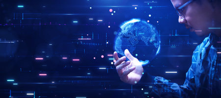 Asian man looks surprised at abstract world holding in hand as digital technology is rapidly...