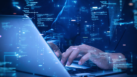 Developer hand typing on laptop with abstract digital code, programming, glowing blue data stream, representing cyber security technology.の写真素材