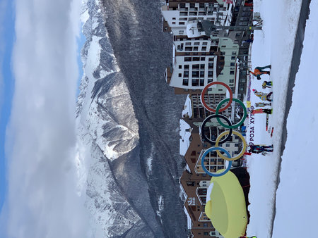 Skiers and snowboarders on the top of a mountain.の写真素材