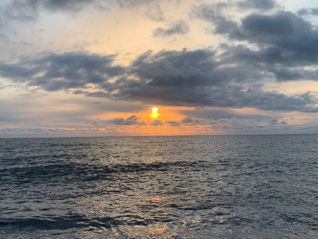 Sunset over the sea in the tropics. Beautiful sky with clouds.の写真素材