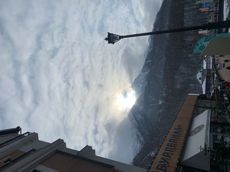 Low angle view of the sun through the clouds.の写真素材
