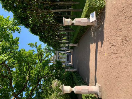 A view of a park with a pathway and decorative columns.の写真素材