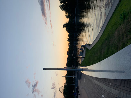 Reflection of the sun in the water surface of a bridge.の写真素材