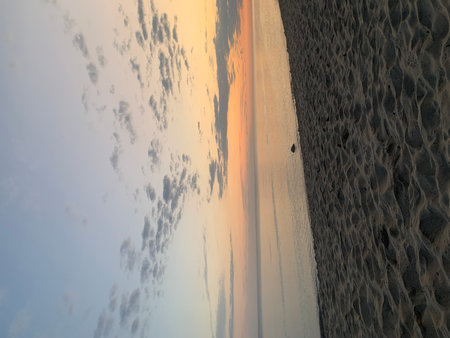 beautiful sunset at the beach, closeup of photo with soft focusの写真素材
