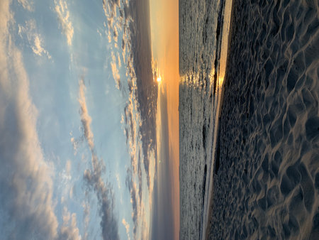 Beautiful sunset over the sea. Sunset on the beach in winter.の写真素材