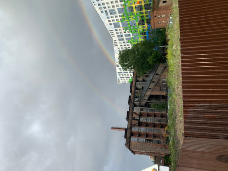 Rainbow over an old house in the cityの写真素材