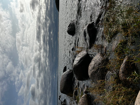 Beautiful seascape with big rocks and blue sky with cloudsの写真素材
