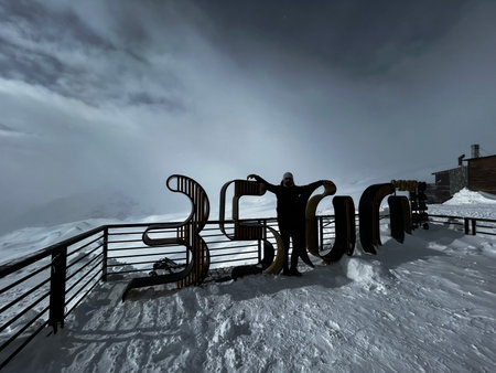 Resort in the mountains in the winter in the clouds.