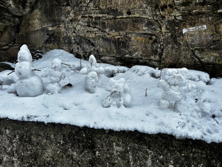 snowman and rock in the snow, closeup of photoの写真素材