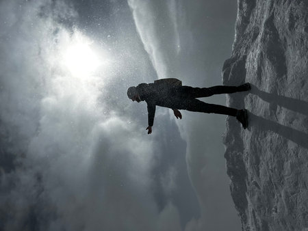 Silhouette of a man jumping over a cliff. Mixed mediaの写真素材