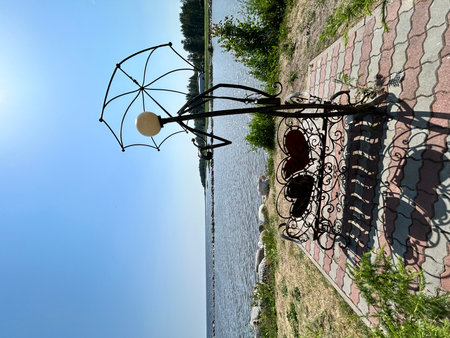 Beautiful street lamp on the background of the river and blue sky. Ladoga lake, beach, summer, photo zone, Saint Petersburgの写真素材