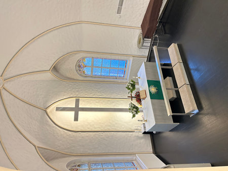 Interior of a church with stained glass window, closeup of photo.の写真素材