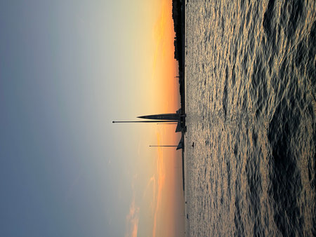 Sunset in the Baltic Sea with a sailboat in the foreground. Saint Petersburg, Lakhta Center, sunsetの写真素材