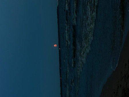 Red moon at the edge of a cliff in the early morning. Red moonの写真素材